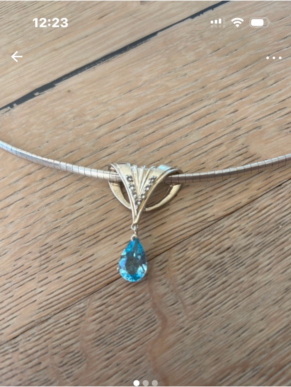 Sterling silver Pendant, with Blue topaz
and a scattering of clear crystals.
